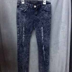Acid washed distressed jeans
